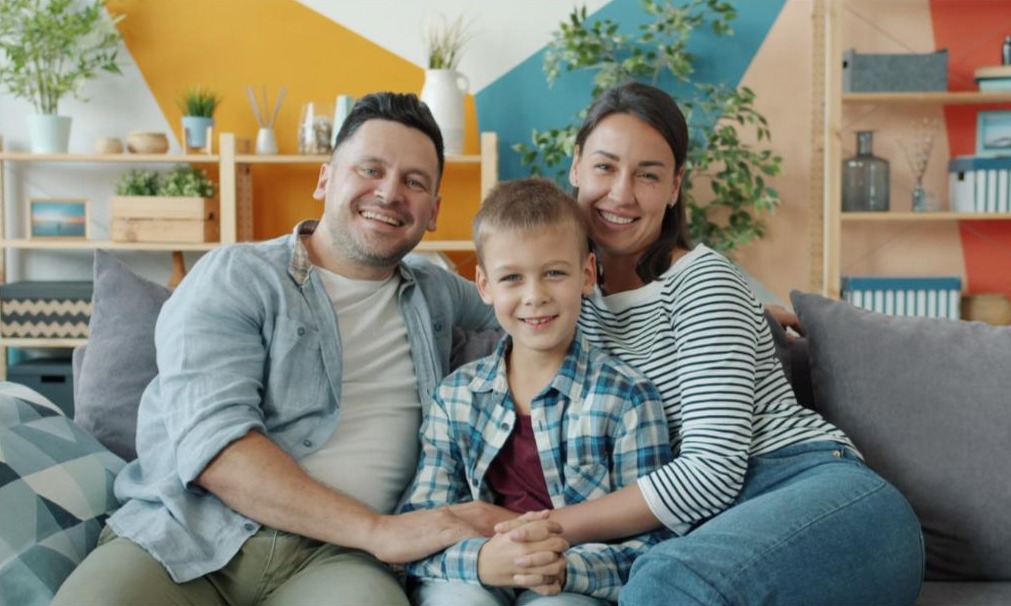 A family reviewing their health coverage options together at home